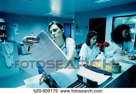 Nurses at admission desk in emergency area View Large Photo Image Stock Photo - Nurses at admission desk in emergency area. Fotosearch