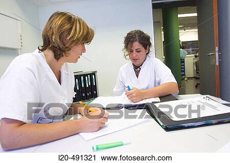 Stock Image - Nurses changing shift, Neurosurgery department. Hospital Universitario Gran Canaria Doctor Negrin, Las Palmas de Gran Canaria. Canary Islands, Spain. Fotosearch