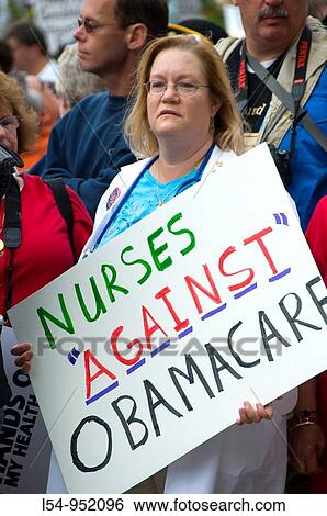 Stock Photograph - Nurses Protest Health Care at Rally Demonstration Washington DC Against Government. Fotosearch