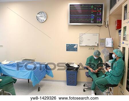 Stock Photograph - Nurses waiting for surgeons during bypass surgery, Reykjavik Iceland. Fotosearch