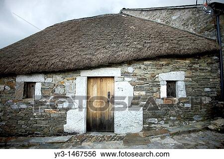 Stock Photograph - O Cebreiro Celtic village, in Galicia region, in the French Way that leads to Santiago de Compostela, Spain. Hundred of thousands pilgrims walk every year to Santiago de Compostela using the French Way in the pilgrimage known as the Way of Saint James. Fotosearch