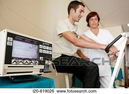 Stock Photograph - Occupational therapy, exercise bicycle test, effort training, oximeter. Hospital Universitario de Gran Canaria Doctor Negrin, Las Palmas de Gran Canaria. Canary Islands, Spain. Fotosearch