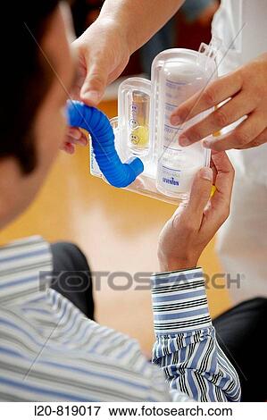 Stock Photo - Occupational therapy, Spiro-Ball Volumetric Incentive Spirometer, respiratory therapy, interstitial pneumopathy. Hospital Universitario de Gran Canaria Doctor Negrin, Las Palmas de Gran Canaria. Canary Islands, Spain. Fotosearch