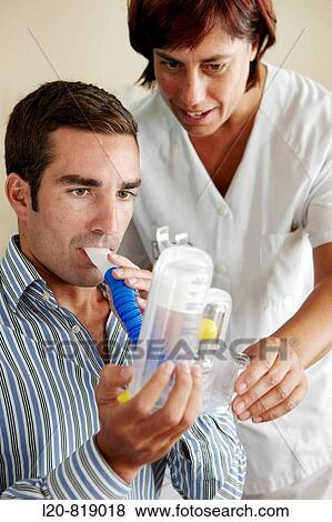Stock Photo - Occupational therapy, Spiro-Ball Volumetric Incentive Spirometer, respiratory therapy, interstitial pneumopathy. Hospital Universitario de Gran Canaria Doctor Negrin, Las Palmas de Gran Canaria. Canary Islands, Spain. Fotosearch