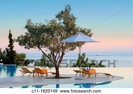 oceania club showing infinity swimming pool at sunset halkidiki macedonia central greece europe View Large Photo Image Stock Photo - oceania club showing infinity swimming pool at sunset halkidiki macedonia central greece europe. Fotosearch
