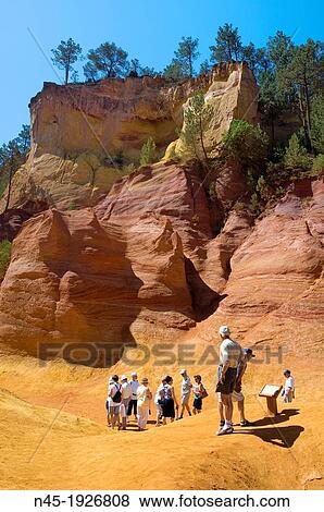 Ockre Rocks; Ocher Quarry; Cliffs; Colorado; Roussillon; Tourists are visiting the Ockre Rocks; Provence; France. View Large Photo Image Stock Photo - Ockre Rocks; Ocher Quarry; Cliffs; Colorado; Roussillon; Tourists are visiting the Ockre Rocks; Provence; France.. Fotosearch