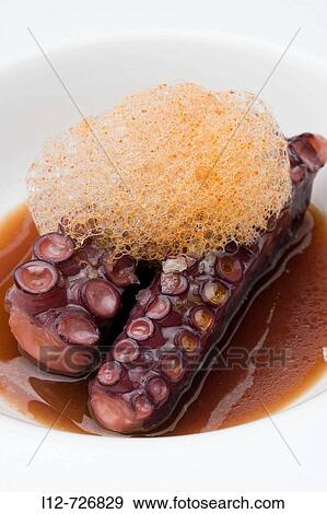Octopus with foam of garlic sauce at restaurant Pandemonium by chef Antonio Botana, Cambados. Pontevedra province, Galicia, Spain View Large Photo Image Stock Photo - Octopus with foam of garlic sauce at restaurant Pandemonium by chef Antonio Botana, Cambados. Pontevedra province, Galicia, Spain. Fotosearch