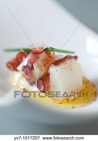 Stock Photo - Octopus with paprika and olive oil. Fotosearch