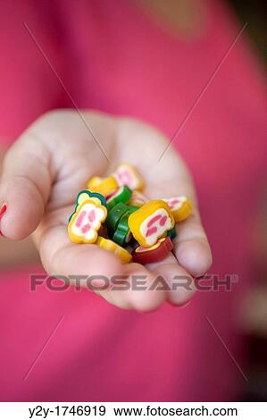 Offering candy girl View Large Photo Image Stock Photo - Offering candy girl. Fotosearch