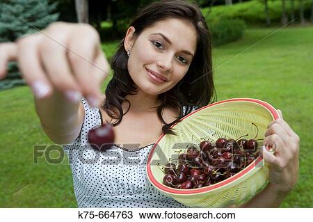 Stock Image - Offering some fruit. Fotosearch