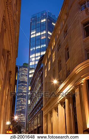 Stock Photo - Office building in the City of London at night, Throgmorton Street towards Old Broad Street, England.. Fotosearch