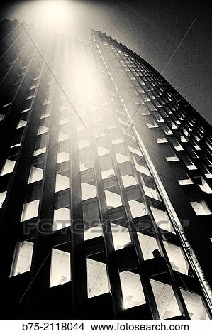 Office building in the evening with a lighted lamppost. London, England, UK, Europe. View Large Photo Image Picture - Office building in the evening with a lighted lamppost. London, England, UK, Europe.. Fotosearch