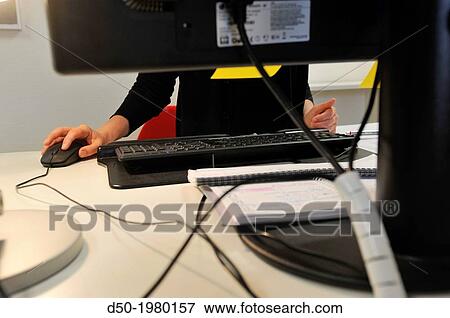 Office worker at a translation agency. Computer. Stockholm, Sweden View Large Photo Image Stock Photo - Office worker at a translation agency. Computer. Stockholm, Sweden. Fotosearch