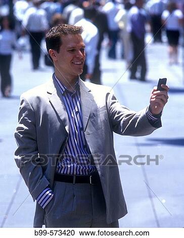 Stock Image - Office worker, Fifth Avenue, Midtown, Manhattan, New York, USA. Fotosearch