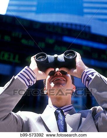 Office worker looking through binoculars below stock market ticker display. View Large Photo Image Stock Image - Office worker looking through binoculars below stock market ticker display.. Fotosearch