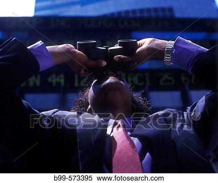 Office worker looking through binoculars below stock market ticker display. View Large Photo Image Stock Photography - Office worker looking through binoculars below stock market ticker display.. Fotosearch