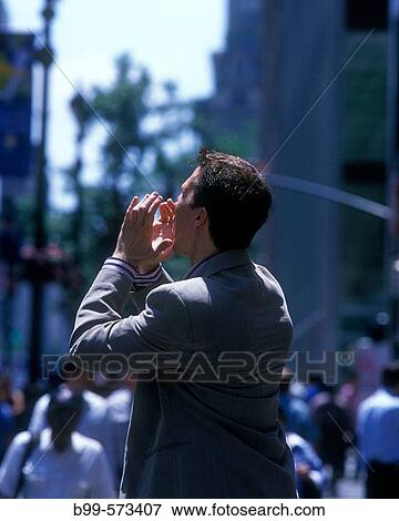 Stock Photo - Office worker on fifth Avenue, Midtown, Manhattan, New York, USA. Fotosearch