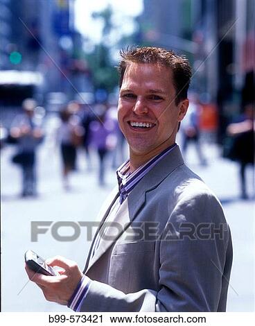 Office worker with cell phone, Fifth Avenue, Midtown, Manhattan, New York, USA View Large Photo Image Stock Image - Office worker with cell phone, Fifth Avenue, Midtown, Manhattan, New York, USA. Fotosearch