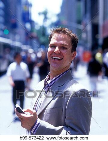 Office worker with cell phone, Fifth Avenue, Midtown, Manhattan, New York, USA View Large Photo Image Stock Image - Office worker with cell phone, Fifth Avenue, Midtown, Manhattan, New York, USA. Fotosearch