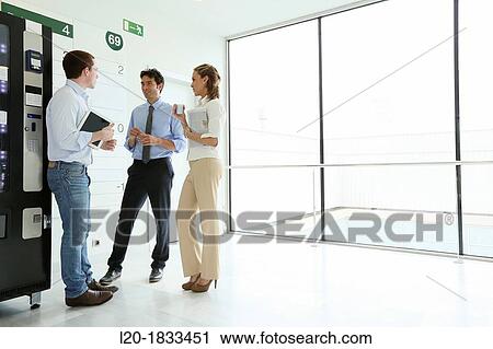 Office workers taking a break View Large Photo Image Stock Image - Office workers taking a break. Fotosearch