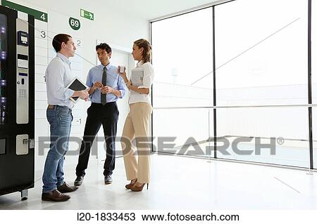 Office workers taking a break View Large Photo Image Stock Image - Office workers taking a break. Fotosearch