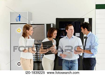 Office workers taking a break View Large Photo Image Stock Photography - Office workers taking a break. Fotosearch