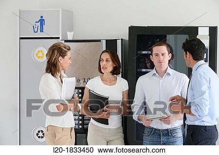 Office workers taking a break, together View Large Photo Image Stock Image - Office workers taking a break, together. Fotosearch