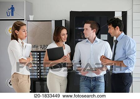 Stock Photo - Office workers taking a break, together. Fotosearch