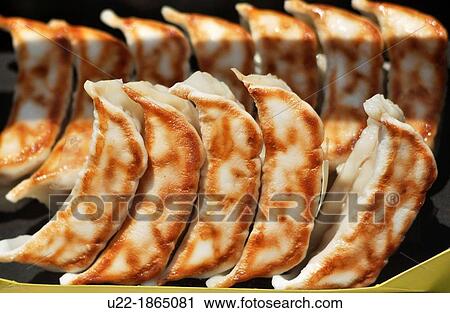 Stock Image - Ofuna, Kanagawa, Japan, fake gyoza dumplings at a restaurant window. Fotosearch