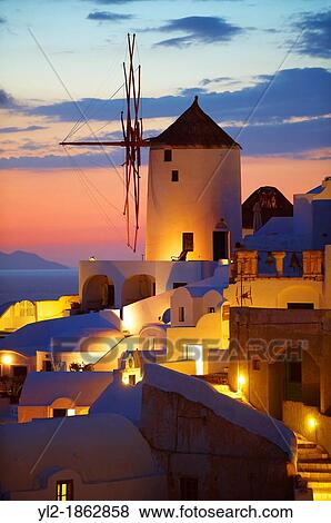 Oia Ia Santorini - Windmills and town at sunset, Greek Cyclades islands View Large Photo Image Stock Photo - Oia Ia Santorini - Windmills and town at sunset, Greek Cyclades islands. Fotosearch