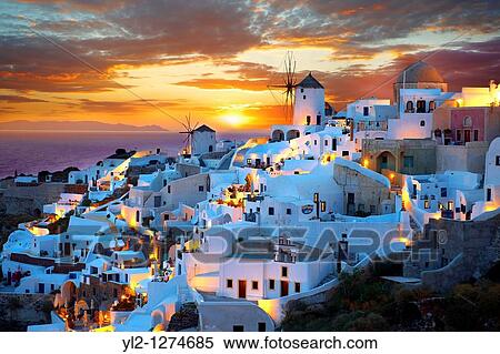 Oia Ia Santorini - Windmills and town at sunset, Greek Cyclades islands - Photos, pictures and images View Large Photo Image Stock Photography - Oia Ia Santorini - Windmills and town at sunset, Greek Cyclades islands - Photos, pictures and images. Fotosearch