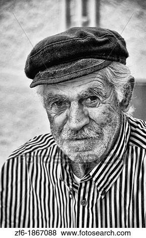 Oia Santorini Greece with a local interesting fisherman portrait View Large Photo Image Stock Photo - Oia Santorini Greece with a local interesting fisherman portrait. Fotosearch
