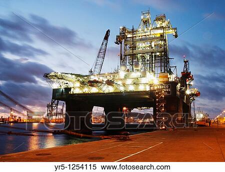 Stock Photography - Oil rig at sunset Puerto de La Luz, Las Palmas, Gran Canaria. Fotosearch