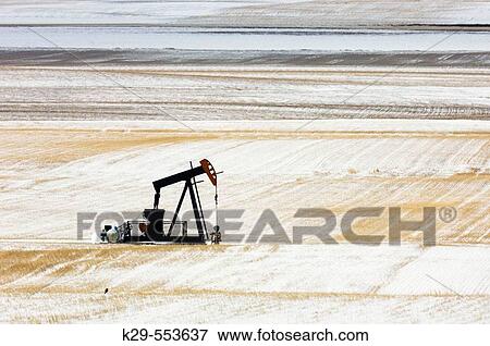 Oil well pump? jack? in snowy prairie. Alberta, Canada View Large Photo Image Stock Photo - Oil well pump? jack? in snowy prairie. Alberta, Canada. Fotosearch