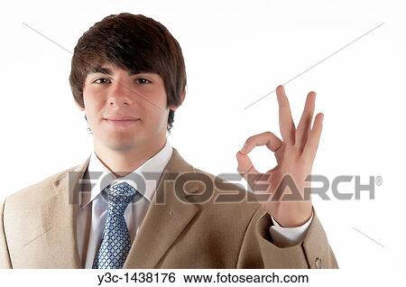 OK sign - young man showing success and confidence View Large Photo Image Stock Photograph - OK sign - young man showing success and confidence. Fotosearch
