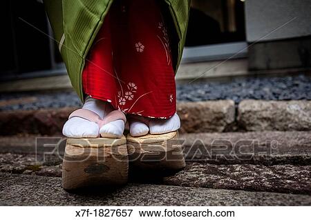 Okobo tall wooden shoes Detail of? maiko? geisha apprentice from Ishihatsu tea house o-chaia Geisha's distric of Miyagawacho Kyoto Kansai, Japan View Large Photo Image Stock Photo - Okobo tall wooden shoes Detail of? maiko? geisha apprentice from Ishihatsu tea house o-chaia Geisha's distric of Miyagawacho Kyoto Kansai, Japan. Fotosearch