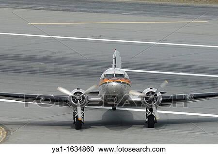 Old airplane Douglas DC-3 Dakota running on the taxiway, Anchorage, Alaska, USA View Large Photo Image Stock Image - Old airplane Douglas DC-3 Dakota running on the taxiway, Anchorage, Alaska, USA. Fotosearch