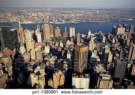 Old and new buildings forming the vast cityscape of Manhattan seen from the Empire State Building, New York, USA View Large Photo Image Stock Image - Old and new buildings forming the vast cityscape of Manhattan seen from the Empire State Building, New York, USA. Fotosearch