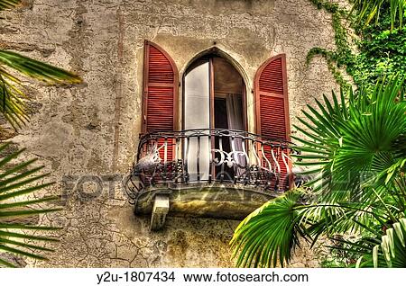 Old balcony with palm leaves View Large Photo Image Picture - Old balcony with palm leaves. Fotosearch