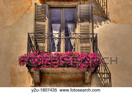 Old balcony with red flowers View Large Photo Image Stock Photography - Old balcony with red flowers. Fotosearch