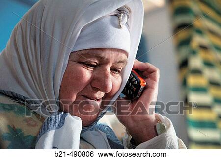 Old berber lady with a cell phone, (mobile) at Targha. Rif. Morocco. View Large Photo Image Stock Photograph - Old berber lady with a cell phone, (mobile) at Targha. Rif. Morocco.. Fotosearch