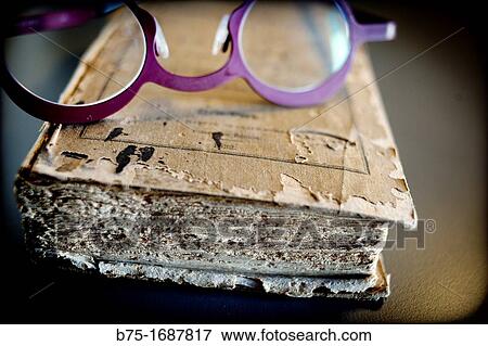Old book with glasses for reading View Large Photo Image Stock Photo - Old book with glasses for reading. Fotosearch