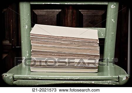 Old books on a chair. View Large Photo Image Stock Image - Old books on a chair.. Fotosearch