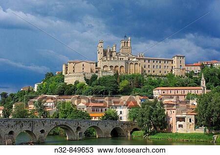 Old bridge and cathedral of Saint Nazaire, Beziers. Herault, Languedoc-Roussillon, France View Large Photo Image Stock Image - Old bridge and cathedral of Saint Nazaire, Beziers. Herault, Languedoc-Roussillon, France. Fotosearch