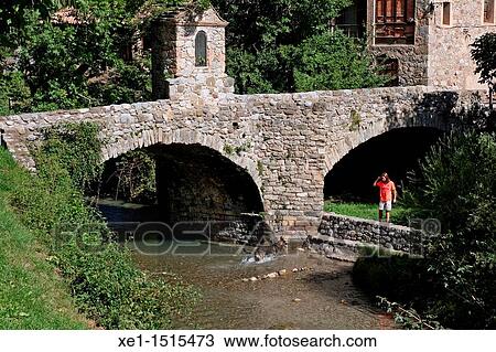 Stock Image - Old Bridge, Bastareny river, BagB, Catalonia, Spain.. Fotosearch
