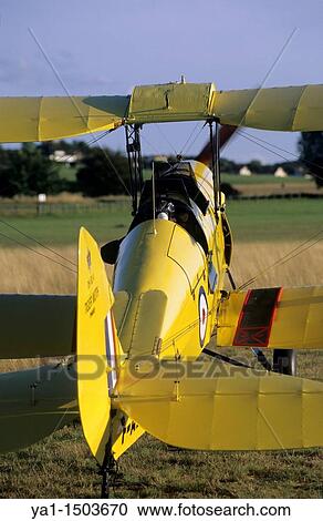 Stock Image - Old British trainer biplane De Havilland DH-82a Tiger Moth. Fotosearch