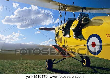 Old British trainer biplane De Havilland DH-82a Tiger Moth View Large Photo Image Stock Image - Old British trainer biplane De Havilland DH-82a Tiger Moth. Fotosearch
