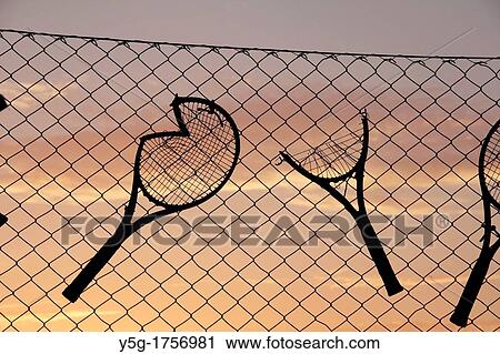 Old broken tennis rackets tied to fence at tennis club View Large Photo Image Stock Image - Old broken tennis rackets tied to fence at tennis club. Fotosearch