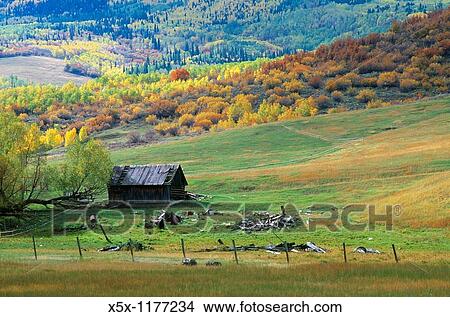 Old cabin at the foot of Emerald mountain in fall, Steamboat Springs, Colorado, USA View Large Photo Image Picture - Old cabin at the foot of Emerald mountain in fall, Steamboat Springs, Colorado, USA. Fotosearch