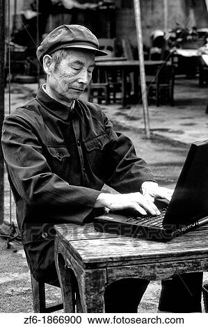 Old Chinese man on laptop computer in Shanghai China View Large Photo Image Stock Image - Old Chinese man on laptop computer in Shanghai China. Fotosearch